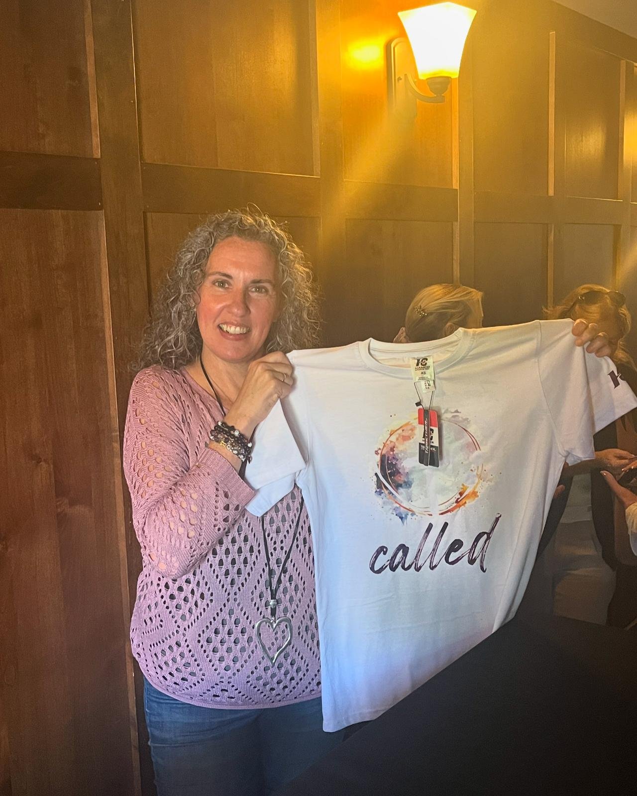 An author holding a custom Hamco t-shirt.