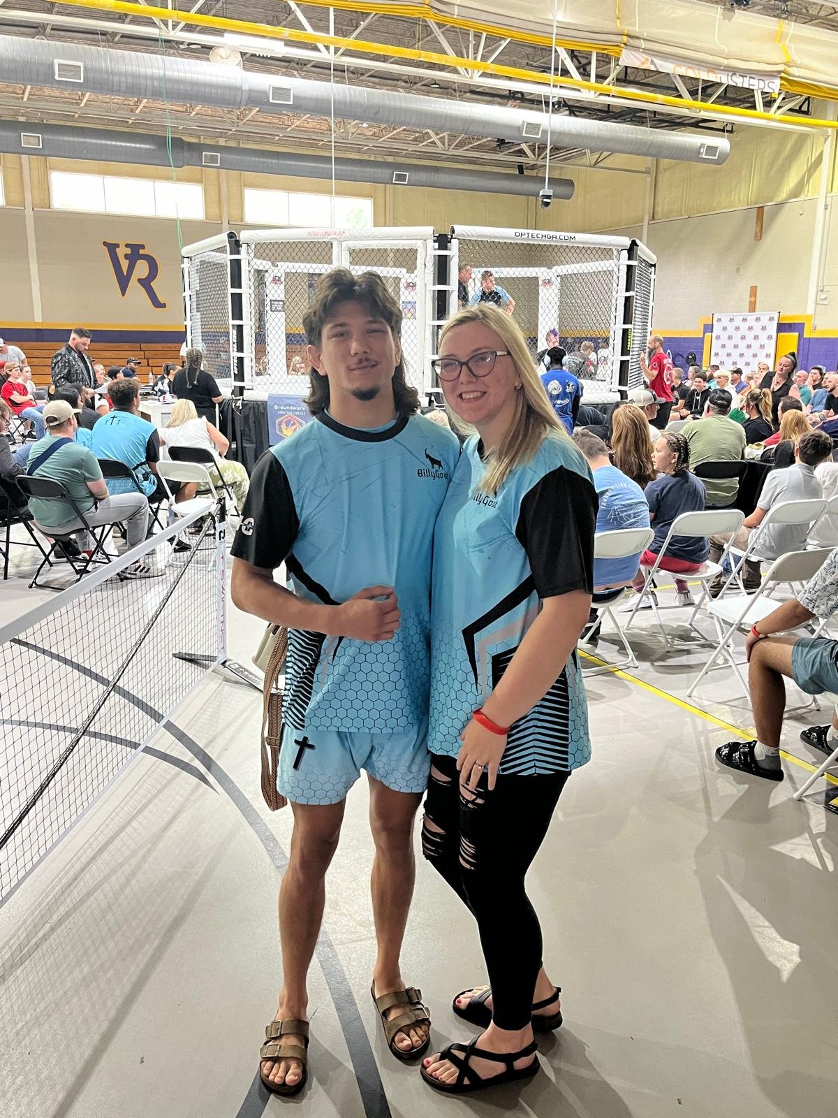 Billy Goat standing with his wife, both in custom Hamco t-shirts.