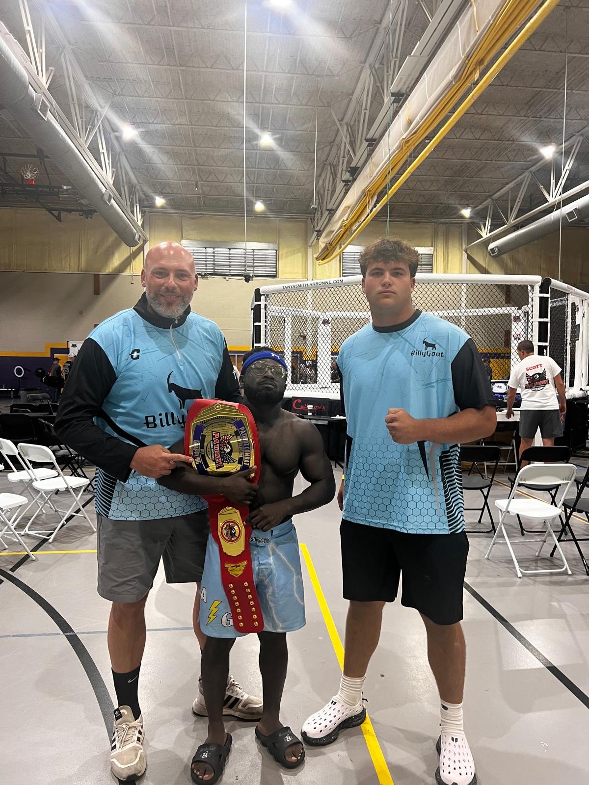 Wrestlers Billy Goat and Baby Hulk standing together.
