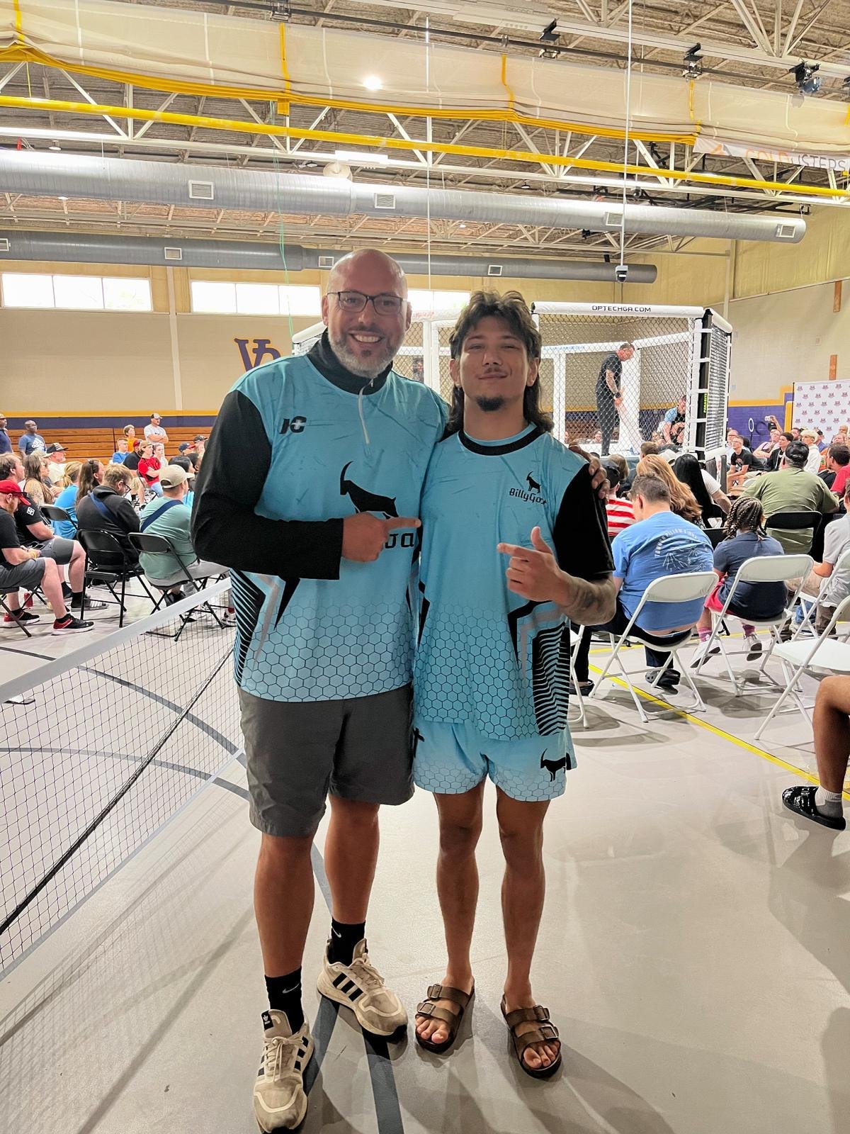 Billy Goat with a Hamco representative, both wearing custom t-shirts.