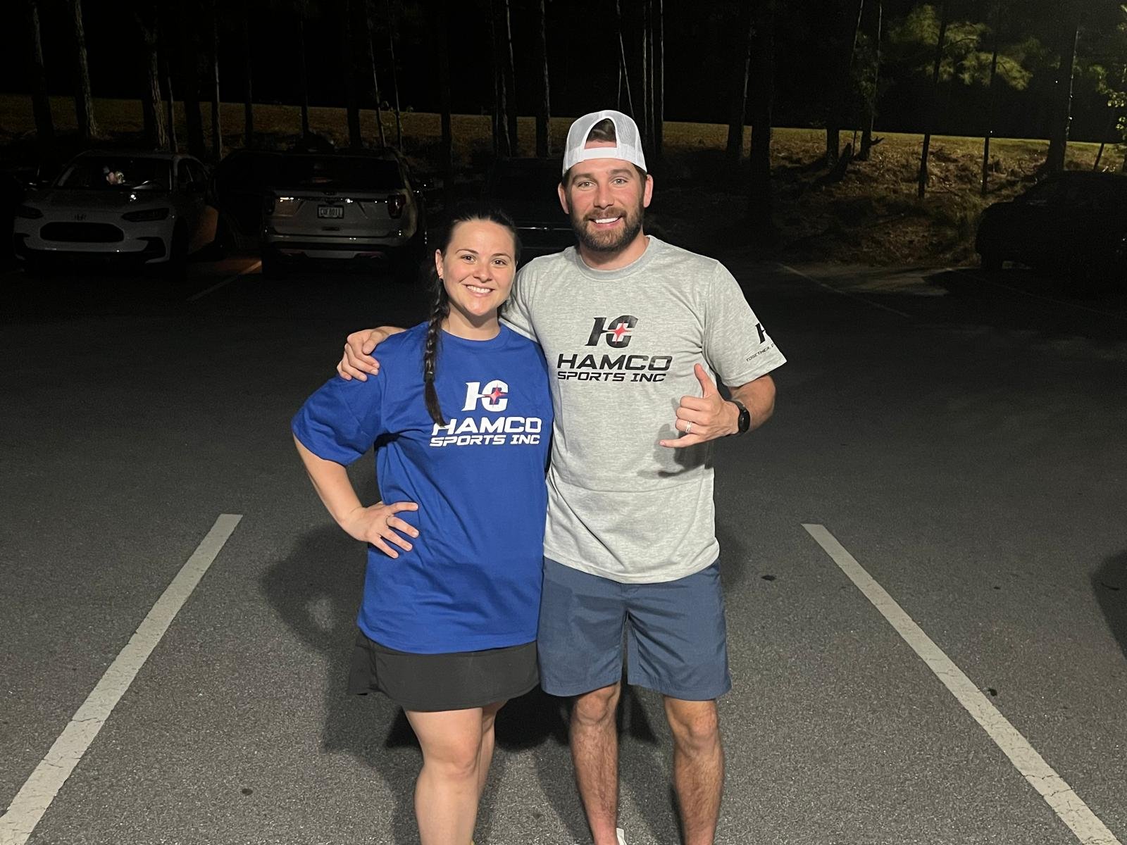The owner of Coliseum Wrestling and his wife in Hamco giveaway t-shirts.