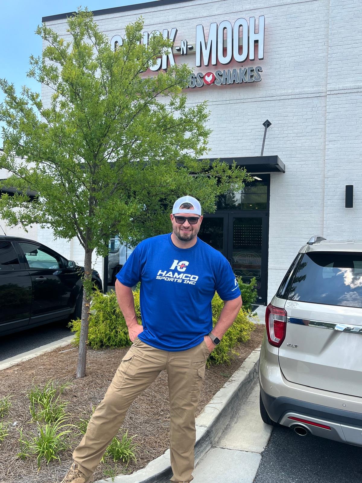 A customer wearing a blue custom Hamco t-shirt.