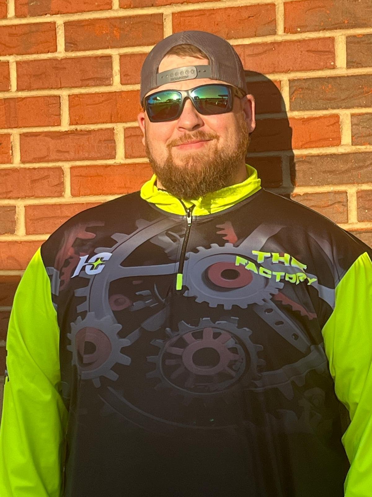 A customer wearing a custom Hamco quarter-zip pullover.