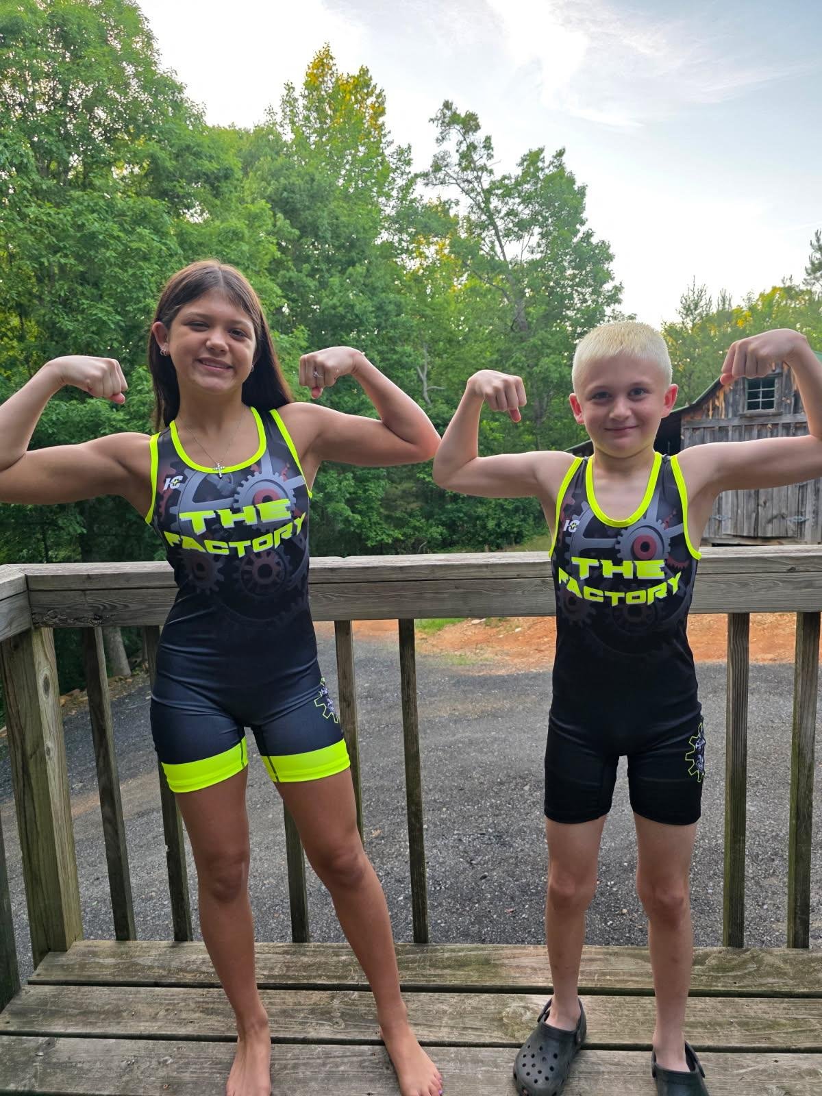 Young players together in their black and neon yellow custom kit.